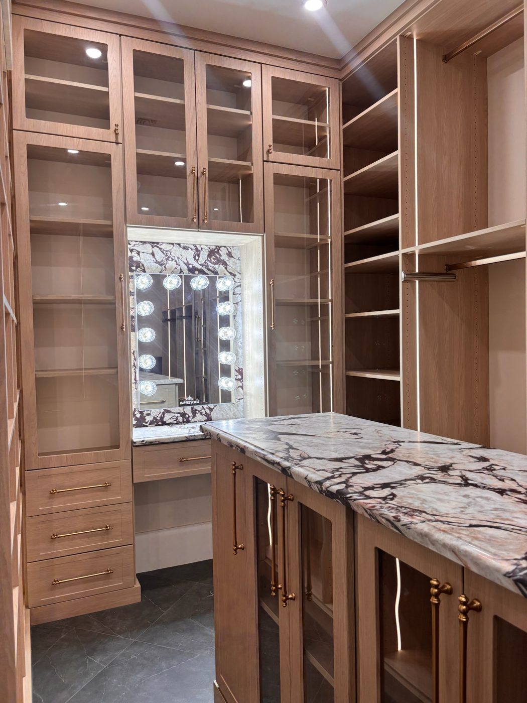 Walk-in closet island with vanity mirror