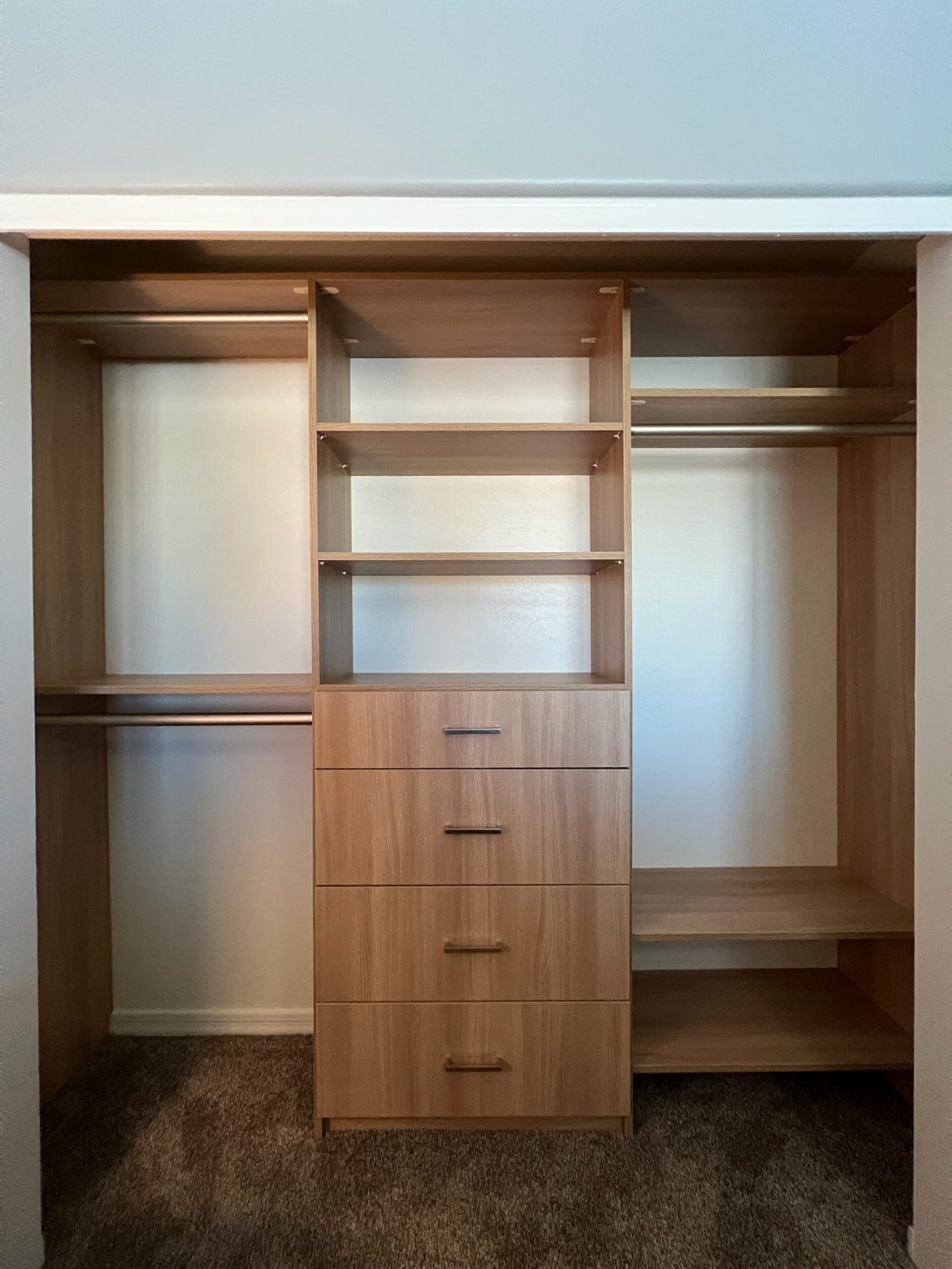 Reach-in closet with oak drawers